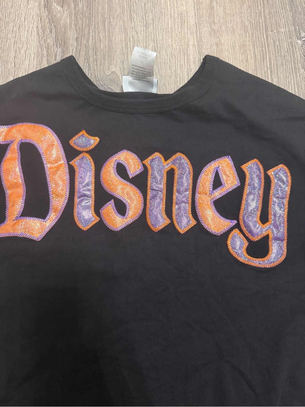 Disney Black Sweatshirt with Orange and Purple 'Disneyland' Script
